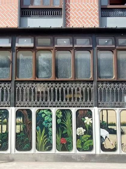 The finished piece at Ssura Koramangala. After fighting the rain, we completed this beautiful series of floral and bird paintings on exterior panels. It's a testament to our team's dedication.