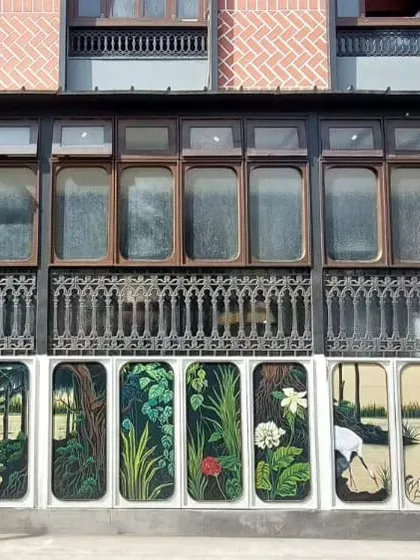 The finished piece at Ssura Koramangala. After fighting the rain, we completed this beautiful series of floral and bird paintings on exterior panels. It's a testament to our team's dedication.