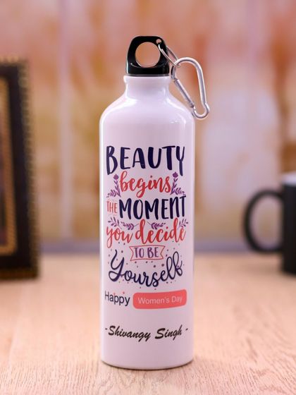 A personalized sipper bottle designed for Women's Day. It features an inspirational quote and can be customized with a name, making it a unique and motivational gift.
