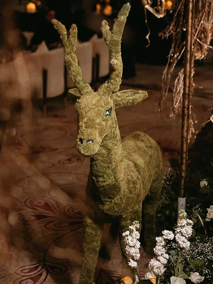 Another angle of the moss deer, showing how it integrates with the surrounding decor to create a whimsical and naturalistic feel.