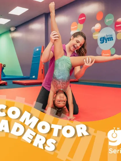 As 'Locomotor Leaders', my grade school students refine their tumbling skills. Here, an instructor guides a gymnast through a walkover, ensuring correct form and building the muscle memory for a lifetime of fitness.
