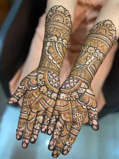 A beautiful example of a full-coverage engagement mehendi, with every inch filled with delicate and clean patterns.