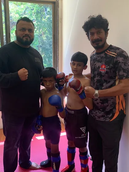 With our wrestling coach and two of our young fighters. We have a team of dedicated coaches to provide specialized training in different aspects of MMA.