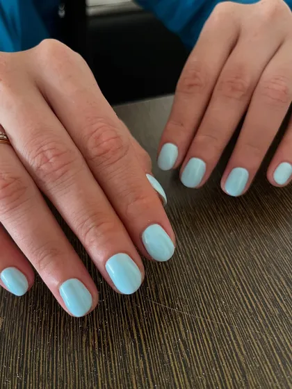 Blue skies on your fingertips. A beautiful, clean manicure in a solid pastel blue gel polish is a perfect way to add a touch of color in a simple, chic way.
