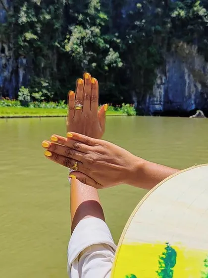 Taking our nails on vacation. This client is rocking a bright, sunny yellow manicure that looks stunning against the beautiful backdrop of Vietnam.