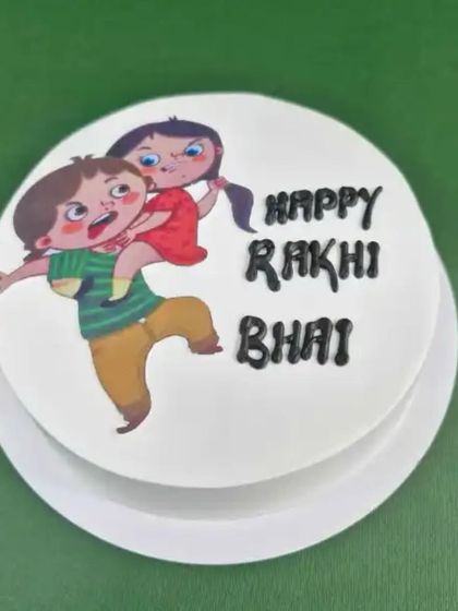 A duplicate of image 19, this playful photo cake is a great way to wish your brother a "Happy Rakhi".
