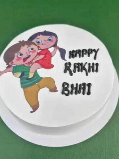 A duplicate of image 19, this playful photo cake is a great way to wish your brother a "Happy Rakhi".