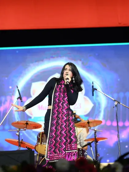 Singing my heart out at the Ganesh Kala Krida Rangmanch. A big stage and a big crowd bring out the best in us.
