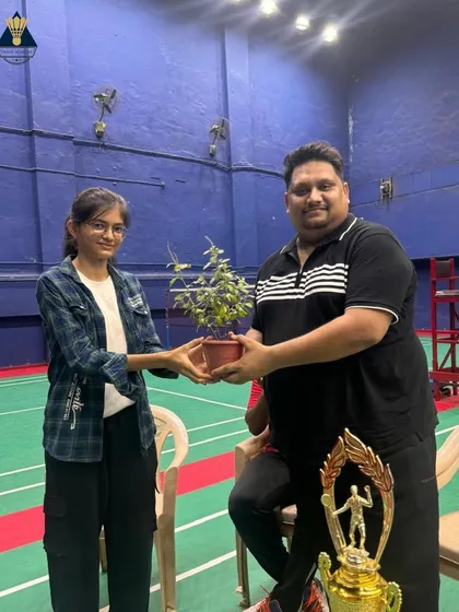 A player being felicitated with a plant, a symbol of growth and nurturing that we believe in at our academy.