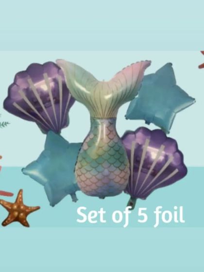 This mermaid foil balloon set includes a large, iridescent mermaid tail, two purple seashell balloons, and two blue star balloons. It's a beautiful combination for an enchanting party atmosphere.