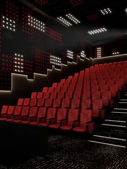 Another view of the private cinema, showcasing the tiered seating and the dynamic lighting patterns on the walls and ceiling. The design creates an ambiance of sophistication and excitement for an unparalleled movie-watching experience.