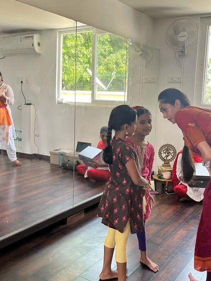 Giving individual attention to the youngest participants at the Adavu Meet. I believe in nurturing talent and passion from a very early age.