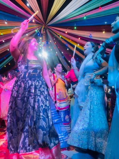 Dancing with guests at the Navratri event. I love to get off the stage and join the party.