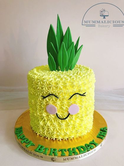 This happy pineapple cake is sure to bring a smile to anyone's face. The cheerful design and bright yellow frosting make it a fun and tropical choice for a summer birthday party or any happy occasion.