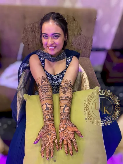 Nothing makes me happier than seeing a smiling client. Here is a beautiful bride-to-be showing her full bridal mehandi. I travel all over Delhi NCR to bring these smiles to your functions.