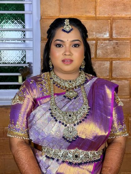 A portrait of Greeshma, looking radiant and beautiful. The makeup enhances her features perfectly.