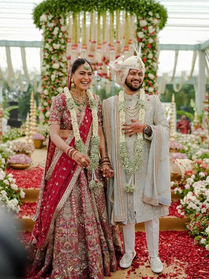 This is the moment it all becomes real. The pure, unscripted joy of a couple surrounded by love and a shower of petals under a mandap we designed just for them. These are the memories I live to create.
