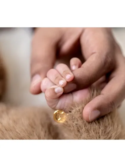 This is the moment that says it all. A tiny hand holding on tight, a symbol of the new, unbreakable bond your family shares. I focus on capturing these quiet, heartfelt connections that you will treasure for a lifetime.