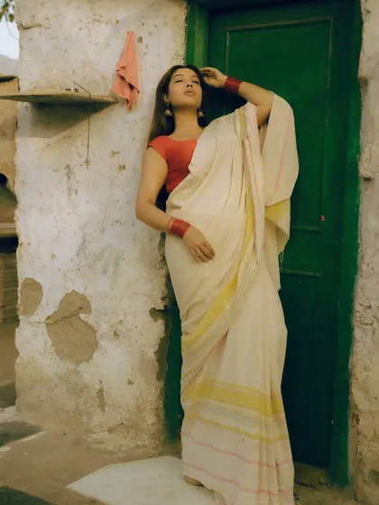 A series from an outdoor shoot, using a rustic green door as a complementary background for the red and white saree. These images show how I use color theory and natural environments to compose a shot.