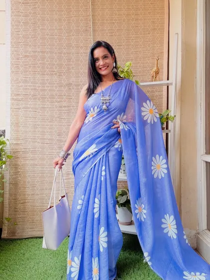 This periwinkle blue Khadi cotton saree with a large daisy print is so charming and cheerful. It's a perfect saree to lift your spirits.