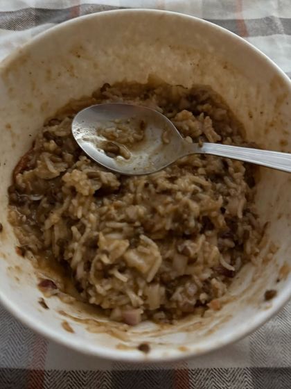 A comforting bowl of dalia or broken wheat porridge, a high-fiber and nutritious meal option for weight management.