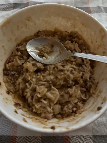 A comforting bowl of dalia or broken wheat porridge, a high-fiber and nutritious meal option for weight management.