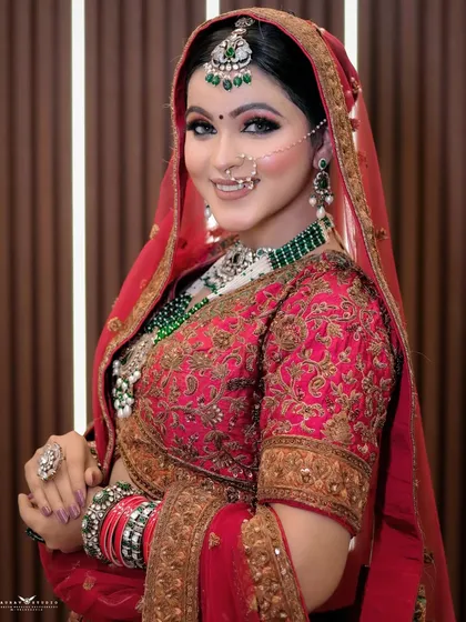 A classic, smiling portrait of the bride looking directly at the camera.