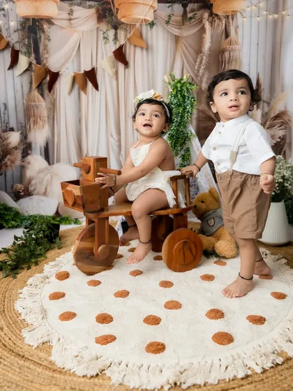 A sweet photo of a brother and sister standing together.