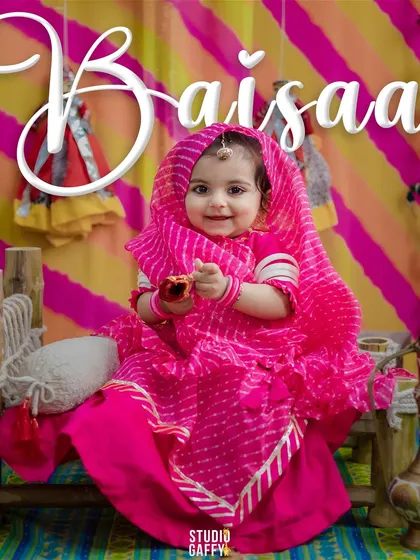 I love bringing cultural stories to life. For this milestone session, we created a vibrant Rajasthani theme, celebrating this little "Baisaa" with traditional attire and a colorful, authentic backdrop.
