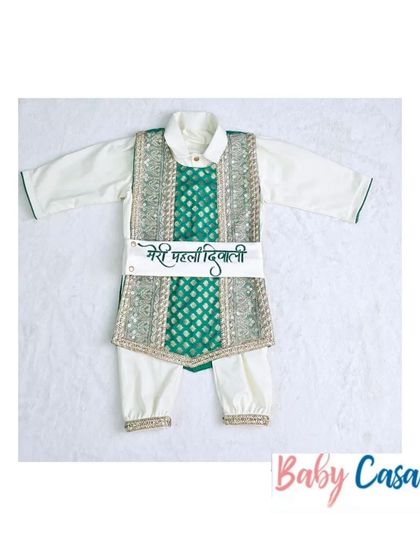 'Meri Pehli Diwali'. This custom ethnic romper with a green brocade vest is perfect for celebrating your baby's very first Diwali in style and comfort.