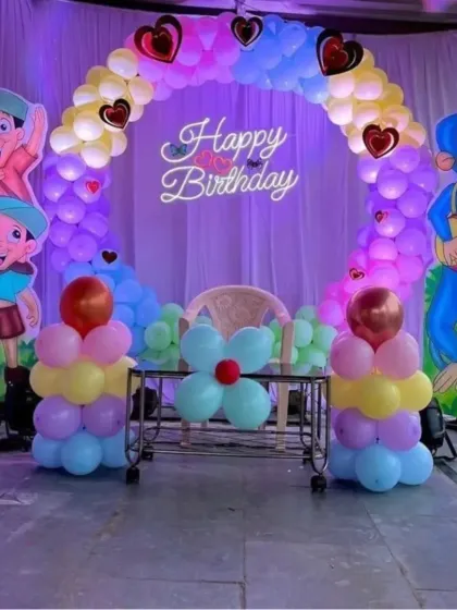 A fun Chhota Bheem themed birthday decoration. I used character standees and a colorful balloon arch to bring the popular cartoon to life for this party.