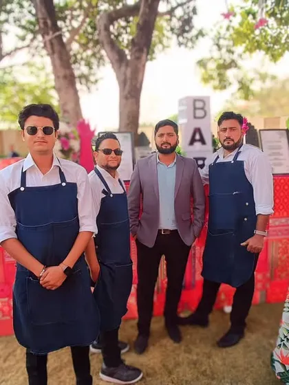 Our professional bartending team, dressed in smart uniforms, ready to serve at a beautiful destination wedding. We ensure our staff is as well-presented as our bar setups.