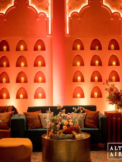 A detail of the candle niches built into the tangerine-colored walls at 'Midnight Marrakesh'. This element added warmth and architectural interest to the space.