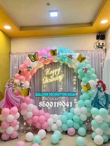A Disney Princess theme featuring Ariel and Aurora. The ring backdrop is decorated with a split-color balloon arch in pink and mint green.
