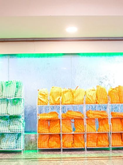 Neatly arranged return gifts ready for guests to take home, displayed against a stylish backdrop.