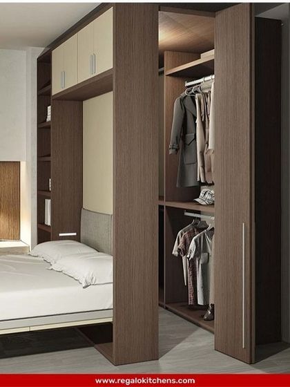 A smart solution for compact spaces. This wardrobe is built around the headboard of the bed, utilizing vertical space for storage without encroaching on the room's footprint.
