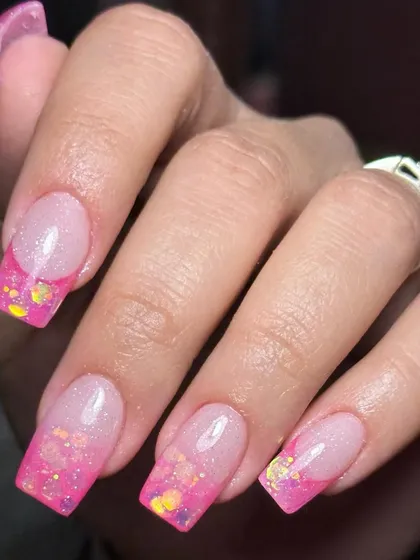 A gradient of grace. Acrylic extensions with a beautiful pink ombre and sparkling inbuilt glitter.