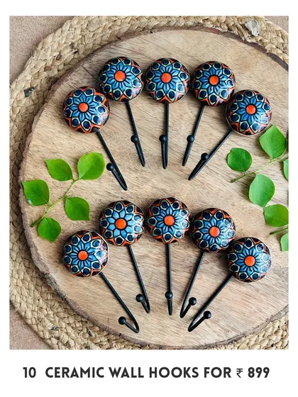 Introducing our new mini ceramic wall hooks. This image shows a set of 10 hand-painted hooks in a vibrant blue and orange design, perfect for adding a pop of color and functionality to your space.
