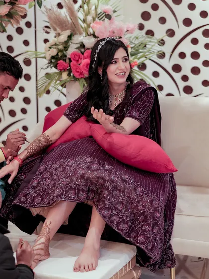 The Mehendi ceremony is a time of happy anticipation. I love capturing these candid moments, where the bride’s joy is infectious as she shares laughter with her loved ones while being adorned with intricate henna.