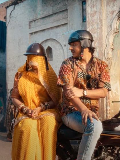 Creating a realistic and humorous moment in the Starsports ad by styling this couple in traditional Rajasthani attire, complete with a ghunghat for the woman.