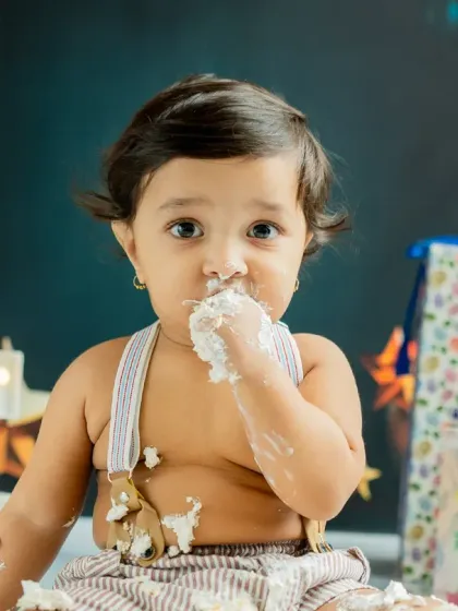 The pure joy of a first taste of birthday cake. I focus on capturing these genuine, unscripted moments during the cake smash session, resulting in photos full of personality and fun.