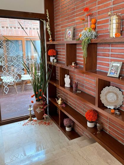 A view of the beautifully decorated shelves in the house, with a mix of modern and ethnic elements.