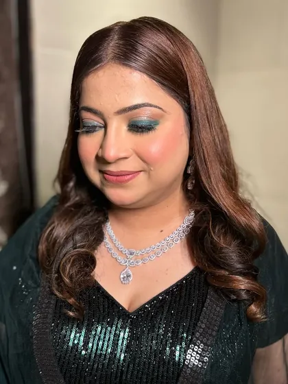 A close-up of the emerald green smokey eye, a bold and beautiful choice for a sangeet night.