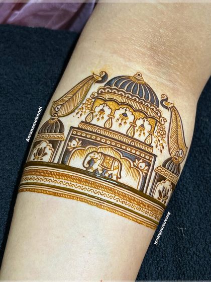 A close-up of the initial arm band design, showing a beautiful palace facade with an elephant. The clean lines and shading create a 3D effect.