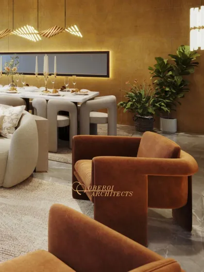 A detail shot of the velvet statement lounge chair, which introduces a rich, earthy color and a bold silhouette to the neutral living space. The dining area in the background features unique, modern chairs.