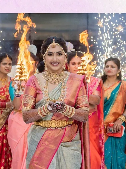 A classic bridal entry is always timeless. Here, the bride enters under a canopy of fire, a traditional and powerful South Indian wedding moment that we were honored to bring to life.