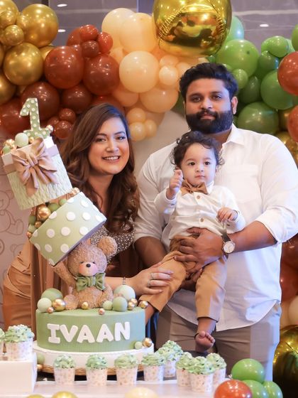 Our family with Ivaan's special topsy-turvy birthday cake. These are the memories I love creating for my family and for my clients.