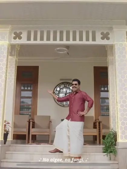 A still from the Asian Paints Ultima Protek ad featuring actor Suraj Venjaramoodu in a traditional Kerala setting.