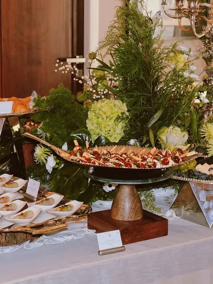 A little tiramisu to sweeten the deal. This image captures a beautiful spread with both savory bites and our classic tiramisu dessert cups.