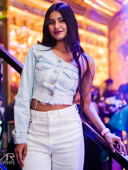 A guest posing on the stairs.